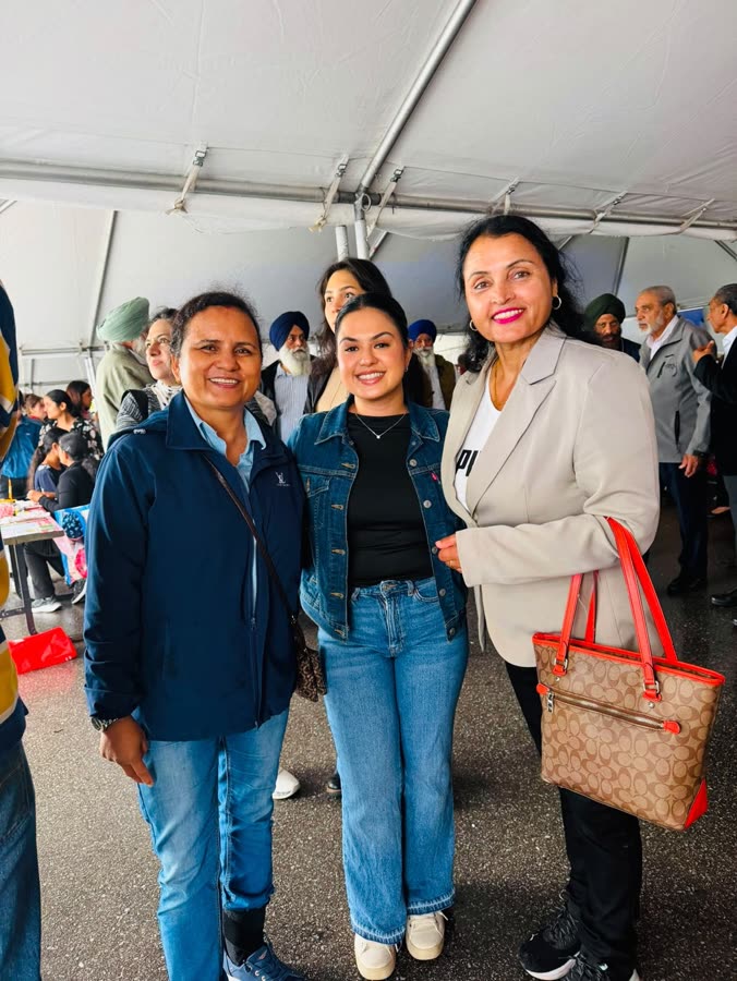 With supporters at a community tent event